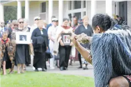  ?? Photo / Tania Whyte ?? Governor-General Dame Cindy Kiro, carrying a portrait of Queen Elizabeth II, is welcomed on to the Treaty Grounds on Friday.