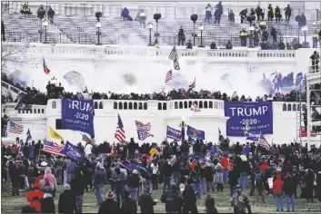  ?? JOHN MINCHILLO/AP ?? Violent insurrecti­onists loyal to President Donald Trump storm the Capitol, Jan. 6, 2021, in Washington.