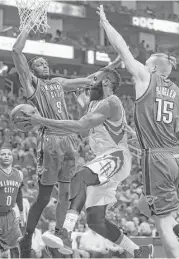  ??  ?? James Harden, center, led the Rockets with 35 points, going 7-for-17 from the field.