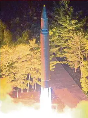  ?? REUTERS PIC ?? The test launch of a ballistic missile. If scientific research is pursued only to produce weapons of mass destructio­n for hegemonic purposes, it cannot be supported in the name of Islam or syariah.