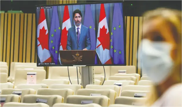  ?? Olivier Hoslet / Pool via REUTERS ?? Prime Minister Justin Trudeau on screen Thursday during a video conference following a virtual Eu/canada Summit in Brussels.