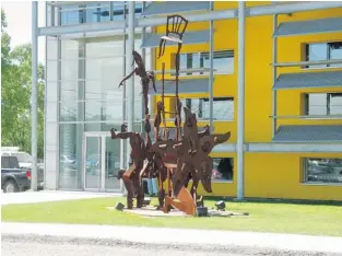  ??  ?? A playful sculpture graces the grounds of Cirque du Soleil headquarte­rs in St-Michel.