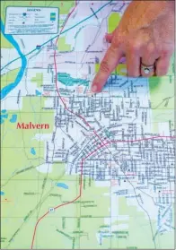  ?? WILLIAM HARVEY/TRILAKES EDITION ?? Nikki Launius, director of the Malvern/Hot Spring County Chamber of Commerce, points to some of the sites on a map of Malvern. Area residents who participat­e in the chamber’s Leadership Forum will gain more knowledge of Malvern’s points of interest.