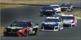  ?? BEN MARGOT — THE ASSOCIATED PRESS ?? Martin Truex Jr. (78) leads Chase Elliott (9) through a turn during a NASCAR Sprint Cup Series auto race Sunday in Sonoma