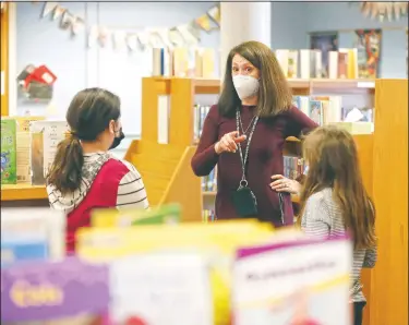  ??  ?? Blanford speaks with students in Elmhurst. “It really requires a team, and I’m so grateful for all of the hard work of all of the people, both here at Emerson and across our School District,” Blanford said.