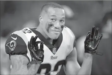  ?? Thearon W. Henderson Getty Images ?? RAMS CORNERBACK Marcus Peters might not have been fined $13,000 if he had stuck to this innocent gesture after his touchdown against Oakland. But grabbing himself after he scored didn’t help.