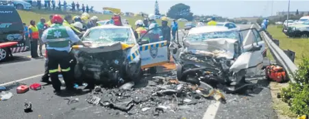  ??  ?? DEATH SCENE: The mangled wrecks of the cars which collided on the N2 yesterday, killing traffic official Msokoli Mbaxa, 57, and Cyril Scott, 93