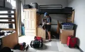  ?? Karen Warren / Staff photograph­er ?? Nick Cascarano, 19, unpacks in his dorm during “move-in day” at the University of St. Thomas.