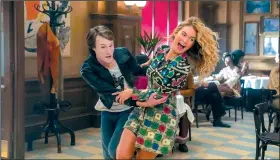  ??  ?? Young Harry (Hugh Skinner) and Young Donna (Lily James) star in Mamma Mia! Here We Go Again, a prequel/sequel to the 2008 musical inspired by ABBA songs.