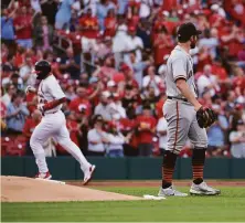  ?? Joe Puetz / Associated Press ?? The Cardinals’ Paul Goldschmid­t circles the bases behind Giants pitcher Carlos Rodón, who allowed eight runs.