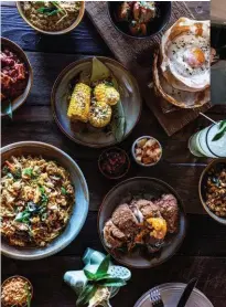  ??  ?? Clockwise from top left: egg hoppers, buttered corn, vegetarian kottu roti and a signature fried chicken at Sydney’s Colombo Social; the bar counter at Brisbane’s Same Same; white anchovy panzanella at Kiosk, Canberra.