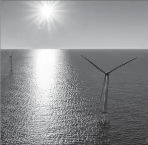  ?? Washington Post file photo ?? Two of the Deepwater Wind turbines, off Block Island, shortly after installati­on last summer.