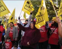  ?? PAUL KITAGAKI JR. STAFF PHOTOGRAPH­ER ?? Sandra Jauregui, center, a fastfood worker for 14 years, and other workers in the industry rally at the state Capitol in Sacramento on Nov. 15, 2022, demanding that fast-food companies such as McDonald's, In-N-Out Burger and Chipotle stop seeking to repeal Assembly Bill 257.