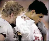  ?? Democrat-Gazette file photo ?? Arkansas offensive linemen Kyle Roper (left) and Jose Valdez sit dejected on the bench in the closing minutes of the loss. It was the most points the Razorbacks allowed since a 103-0 loss to Oklahoma in 1918.