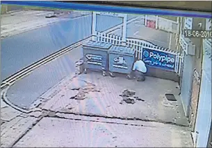  ?? Picture: DARREN CLARKE/FERRARI PRESS AGENCY ?? You’ve bin framed... CCTV catches warden hiding behind bin, ready to strike