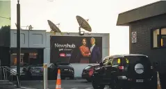  ?? ?? Samantha Hayes and Mike McRoberts on a billboard the day the news broke that the plug will be pulled on the news division.