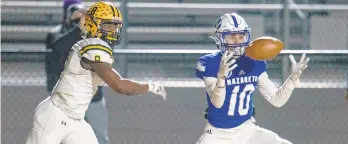  ??  ?? Dominic Feliciano of Nazareth makes a game-ending intercepti­on in the end zone to secure the victory Friday night in Zephyr Stadium. Nazareth’s 37-29 win over Freedom earned the Blue Bombers their second straight 6A crown.