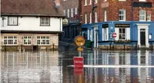  ?? Picture: LNP ?? Alert...a road under water in York yesterday as the River Ouse burst its banks