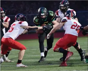  ?? Photo by Ernest A. Brown ?? Jared Beaudoin (22) and the North Smithfield/Mount St. Charles co-op football team controlled the first quarter of Saturday’s game, but Coventry scored 42 unanswered points to earn a 42-3 win.