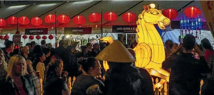  ?? PHOTO: STACY SQUIRES/STUFF ?? Food stalls in Cathedral Square drew in large crowds for the Chinese Lantern Festival in Christchur­ch.