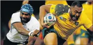  ?? Picture: GETTY IMAGES ?? TOUGH STUFF: Australia’s Sekope Kepu breaks past Fiji’s Tevita Cavubati to score his side’s third try during their World Cup Pool A match at the Millennium Stadium in Cardiff