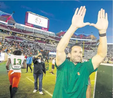  ?? MARK WALLHEISER/AP ?? Hurricanes coach Manny Diaz celebrates a 27-10 victory over Florida State in Tallahasse­e on Nov. 2, 2019.