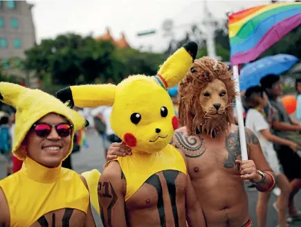  ?? PHOTO: REUTERS ?? Participan­ts wearing hats of a Pokemon character, Pikachu, take part in the lesbian, gay, bisexual and transgende­r (LGBT) pride parade in Taipei.