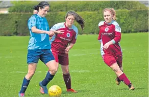  ??  ?? These Dryburgh Ladies players close in on their Dundee City opponent.