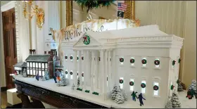  ?? (File Photo/AP/Patrick Semansky) ?? A gingerbrea­d replica of the White House and a sugar cookie replica of Independen­ce Hall are seen on display Nov. 28 in the State Dining Room during a press preview of holiday decoration­s.