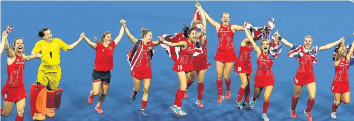  ??  ?? Great Britain’s hockey gold medallists celebrate their triumph after beating the Netherland­s in a penalty shoot-out