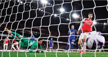  ?? — AFP file photo ?? Arsenal’s Ben White (second left) scores their second goal during the English Premier League match between against Chelsea at the Emirates Stadium in London.