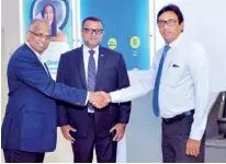  ??  ?? From left: Anand Sundaram, Chief Executive Officer, CCC, Devadharsh­an Jayadeva, Chief Financial Officer, CCC and Nirosh Perera, Assistant General Manager Network Management of HNB opening the new smart Self Service Machine at CCC