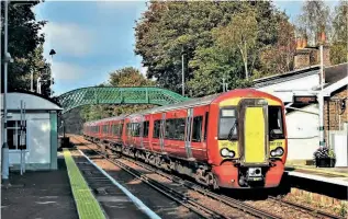  ?? JOHN VAUGHAN ?? The London to Brighton Main Line was closed south of Three Bridges on October 9/10 for engineerin­g work, with services diverted along the Coastway West and Arun Valley lines – leading to the sight of red-liveried Class 387/2 Gatwick Express units Nos. 387221+387211 passing through Amberley with the 1A64/13.05 Victoria to Brighton.