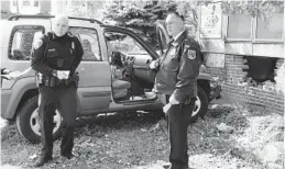  ?? ALGERINA PERNA/BALTIMORE SUN ?? Police officers investigat­e after a Jeep hit the front brick wall of Barclay Elementary/ Middle School. Officials said five students and one adult were hurt, none seriously.