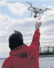  ?? AP ?? Safety regulators are hindering the spread of commercial drones by being too cautious about the risks posed by the flying machines, according to a National Academies of Science, Engineerin­g and Medicine report.