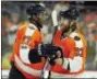  ?? TOM MIHALEK — THE ASSOCIATED PRESS ?? Philadelph­ia Flyers’ Wayne Simmonds, left, congratula­tes Jakub Voracek after he scored a goal during the second period of an NHL hockey game against the Columbus Blue Jackets, Saturday in Philadelph­ia. Simmonds was credited with an assist on the goal.