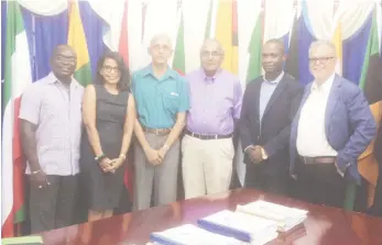  ??  ?? Minister of Communitie­s Ronald Bulkan (third from left) at the signing, (Ministry of Communitie­s photo)