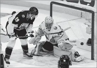  ?? MARTA LAVANDIER/AP PHOTO ?? Atlantic Division’s Matthew Tkachuk, of the Florida Panthers (19) scores against Metropolit­an Division goaltender Ilya Sorokin, of the New York Islanders (30) during the NHL All-Star Game on Saturday.