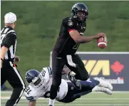  ?? JEAN LEVAC/Postmedia News ?? Redblacks QB Henry Burris and his offence have had
difficulty finding the end zone in recent games.