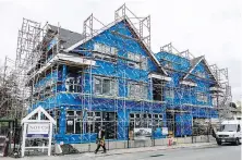  ?? DARREN STONE, TIMES COLONIST ?? A new rental building is nearly complete at the corner of St Patrick Street and Central Avenue in Oak Bay. Casey Edge, executive director of Victoria Residentia­l Builders Associatio­n, says Oak Bay is “notorious for obstructin­g new developmen­t.”