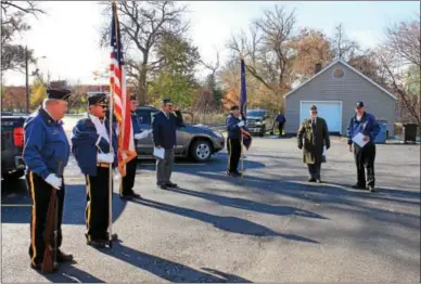  ?? CHARLES PRITCHARD - ONEIDA DAILY DISPATCH ?? Members of the Canastota American Legion prepare to start the ceremony and retire a number of flags on Nov. 112017.