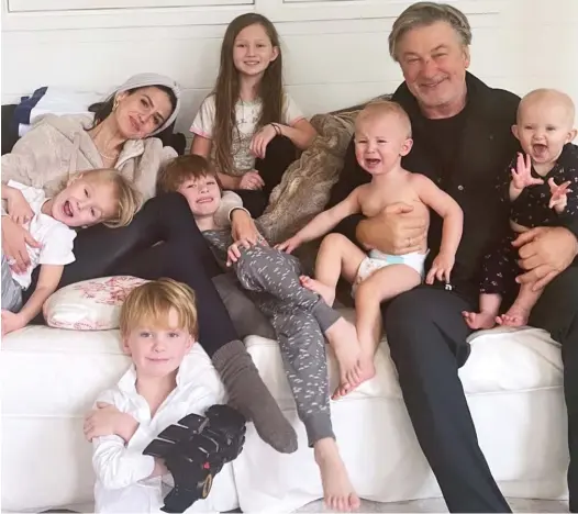  ?? ?? Cosy snap: Alec Baldwin, wife Hilaria and their children Carmen, Rafael, Leonardo, Romeo and babies Eduardo and Lucia