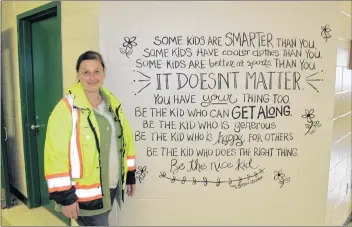  ?? AMANDA DOUCETTE ?? Tiffany Barrett, a crossing guard at Digby Elementary School, painted a mural on a wall at the school but she didn’t expect a viral response when she posted it online.