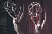  ?? PHOTO BY CHRIS PIZZELLO/INVISION/AP, FILE ?? Emmy statues appear on stage at the 70th Primetime Emmy Nomination­s Announceme­nts at the Television Academy’s Saban Media Center, in Los Angeles.