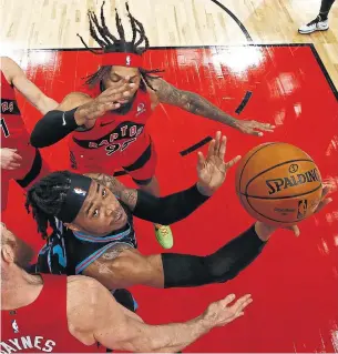  ?? SCOTT AUDETTE GETTY IMAGES ?? After losing to Richaun Holmes and the Kings, Raptors coach Nick Nurse said new additions such as DeAndre’ Bembry, top, and Aron Baynes are still getting used to the system on defence.