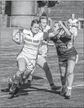  ?? GARY MANNING ?? Natasha Wotton holds of a Saint Mary’s player easily. Wotton posted a try for Acadia in the first half.