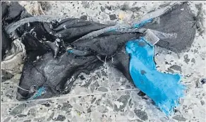  ??  ?? Shreds of fabric from the blue backpack used to carry the bomb