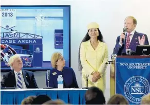  ?? TAIMY ALVAREZ/STAFF PHOTOGRAPH­ER ?? Rick Case and his wife, Rita, thank Nova Southeaste­rn University on Thursday for naming the school’s arena after Case. At left is NSU President George Hanbury with Vice President for Advancemen­t and Community Relations Jennifer O’Flannery Anderson.