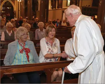  ??  ?? Canon Patsy McDonnell meets with Sr. Monica Taggart and Breda Mcevoy in St. Peters church. They were at his first mass 60 years ago.