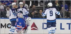  ?? MARY ALTAFFER — THE ASSOCIATED PRESS ?? Rangers goaltender Igor Shesterkin (31) reacts as Winnipeg’s Mark Scheifele (55) celebrates after scoring with teammates Kyle Connor (81) and Alex Iafallo (9) during the second period on Tuesday night.